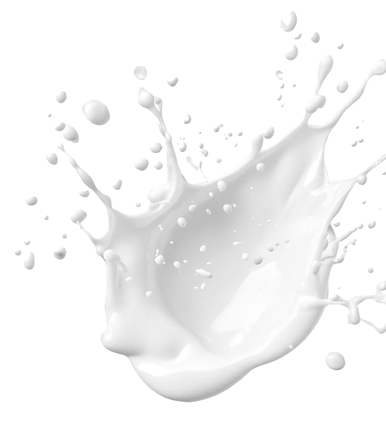 Salpicadura de líquido blanco, probablemente de un ordeñador vegano, congelada en el aire sobre fondo transparente.